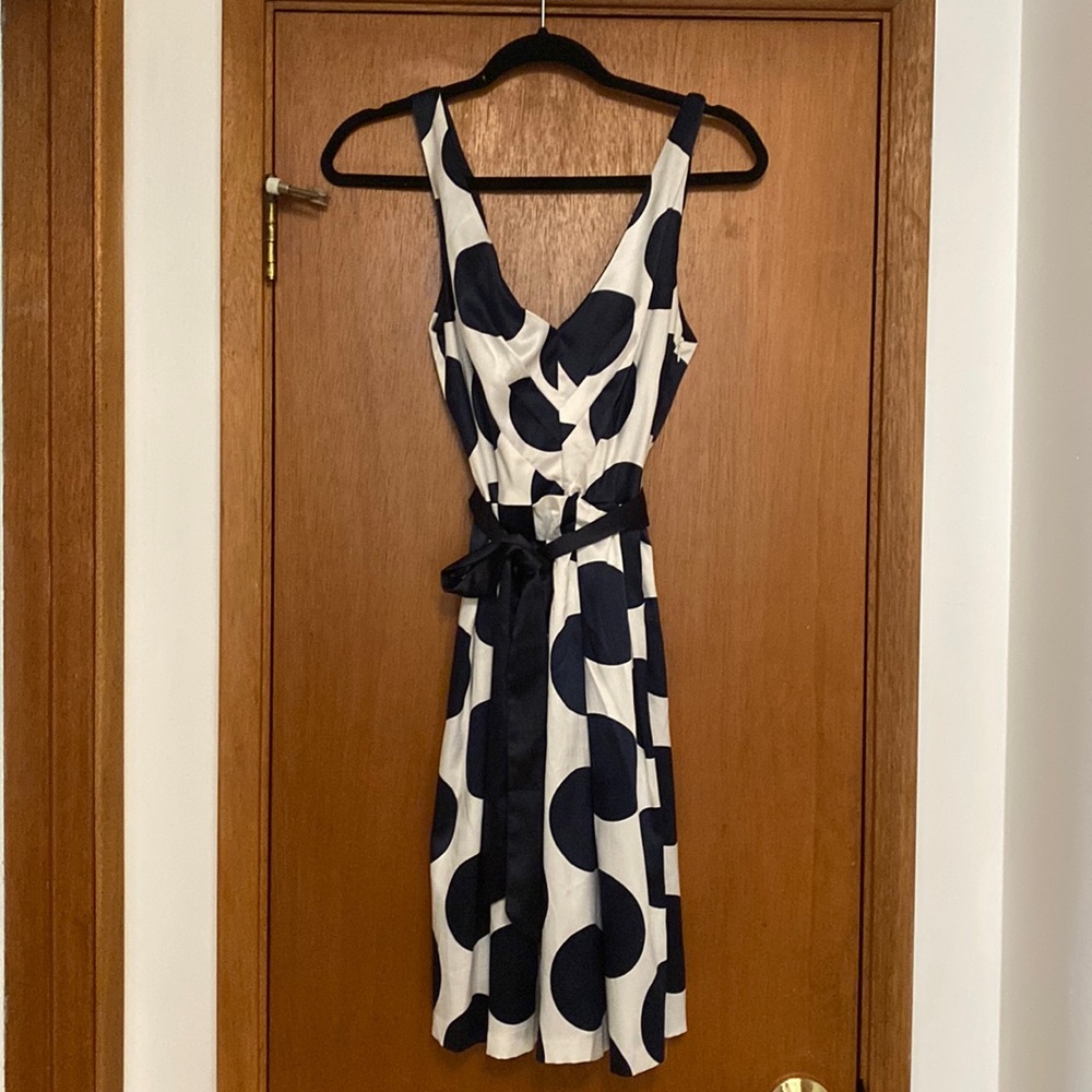 Navy and white satin polka dot party dress with belt